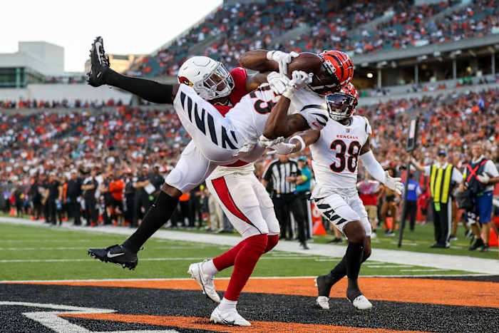 Aug 12, 2022; Cincinnati, Ohio, USA; Cincinnati Bengals safety Dax Hill (23) attempts to intercept the pass intended for Arizona Cardinals tight end Chris Pierce Jr. (49) in the first half at Paycor Stadium. Mandatory Credit: Katie Stratman-USA TODAY Sports